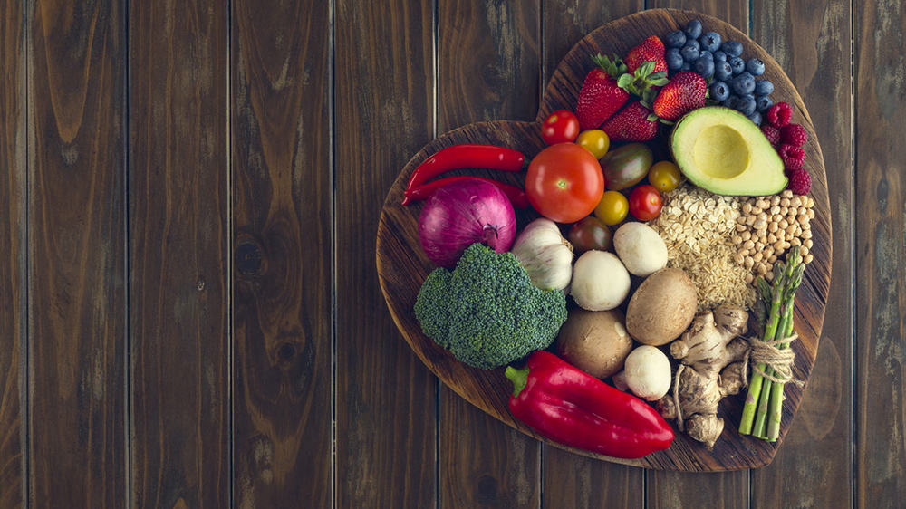 Healthy food on a heart shape cutting board