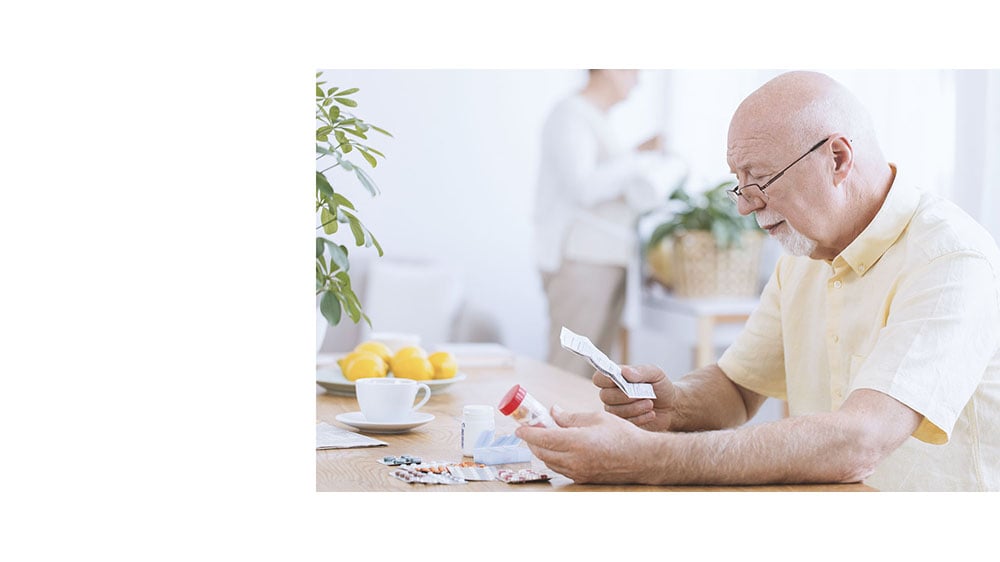 type 2 diabetes man reading his prescriptions