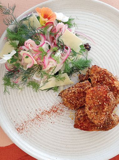 Chicken nuggets with salad on a plate