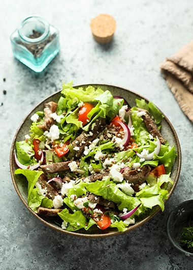 Lamb souvlaki salad in a bowl
