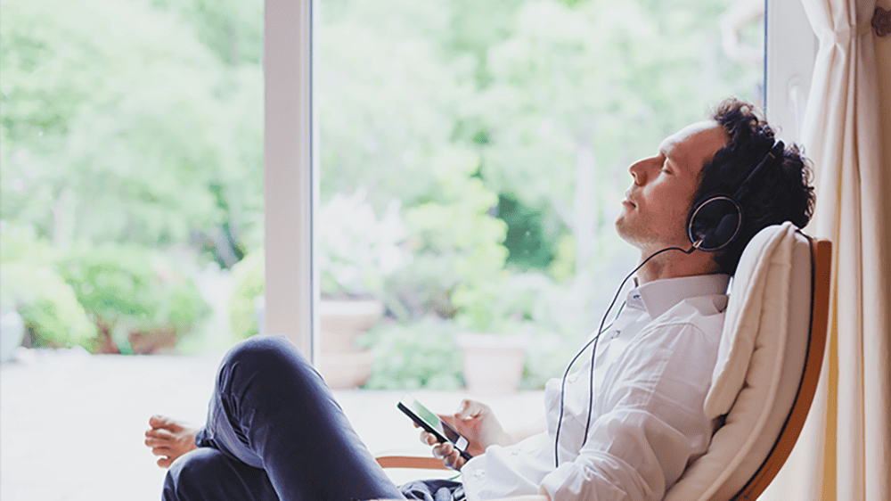man relaxing with headphones