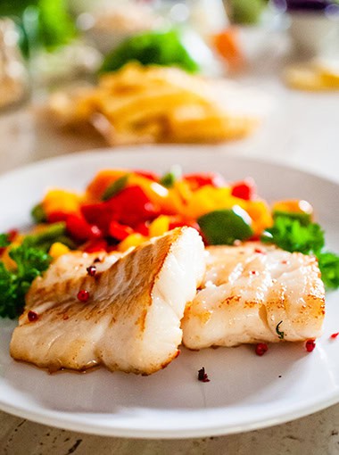 Fried cod fillet and vegetables