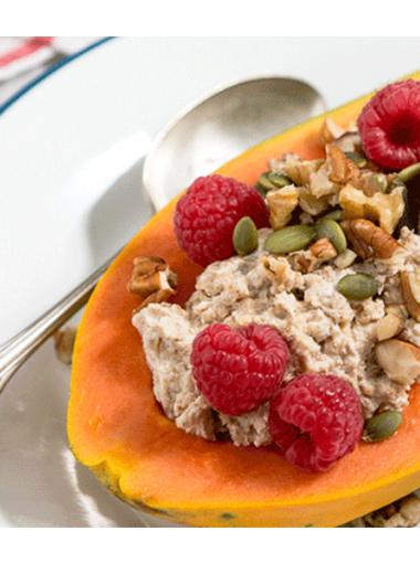 Papaya boat with greek yoghurt seeds and raspberries