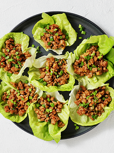 Peri peri chicken in lettuce cups, served on a plate