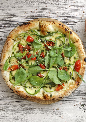 pizza with rocket and tomato