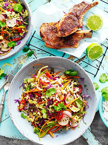 Pork Cutlets with Asian Slaw and rice topped with coriander and chilli