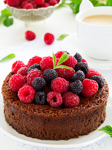 chocolate cake topped with mixed berries