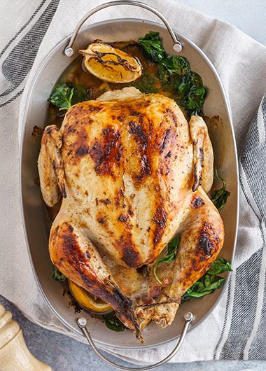 Roast chicken resting in serving platter