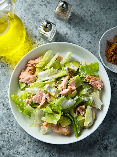 Salmon with salad in a bowl, ready to eat
