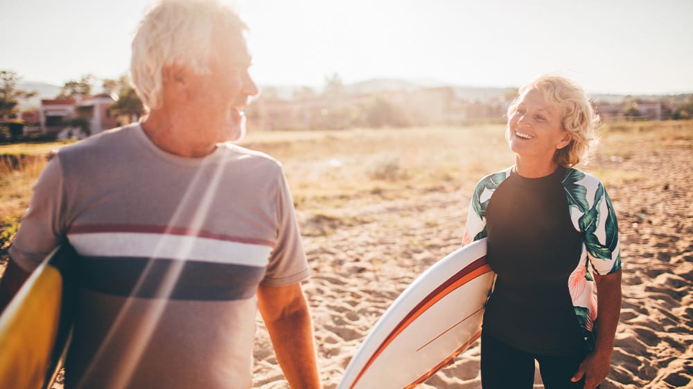 senior surfing couple