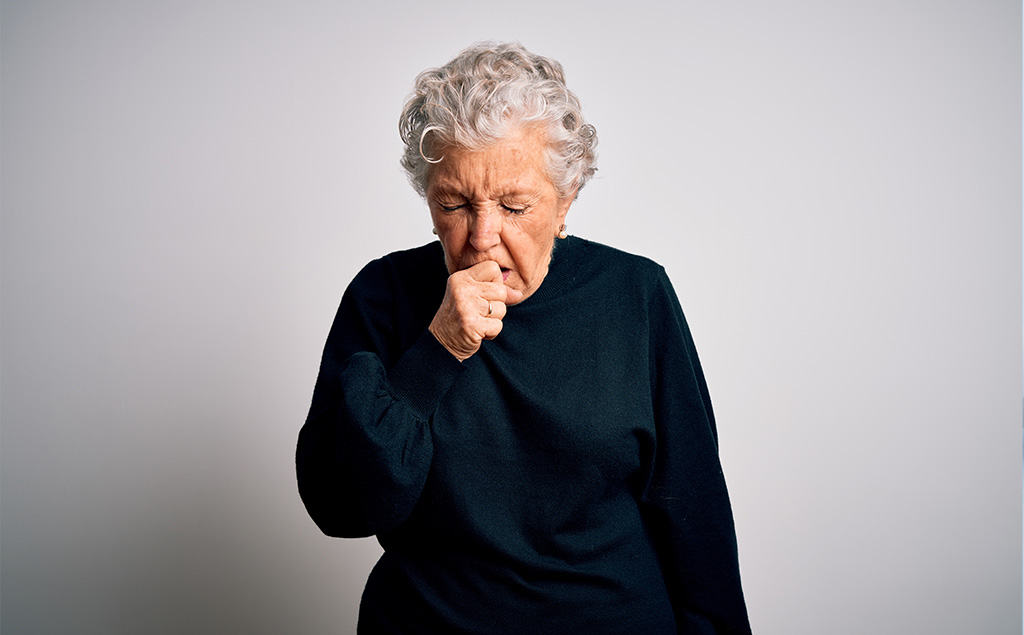 senior woman coughing