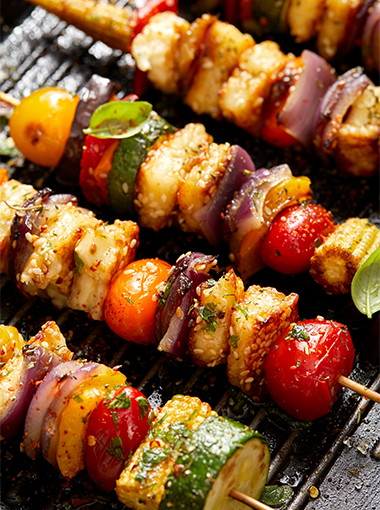 Sesame garlic tofu skewers on a grill