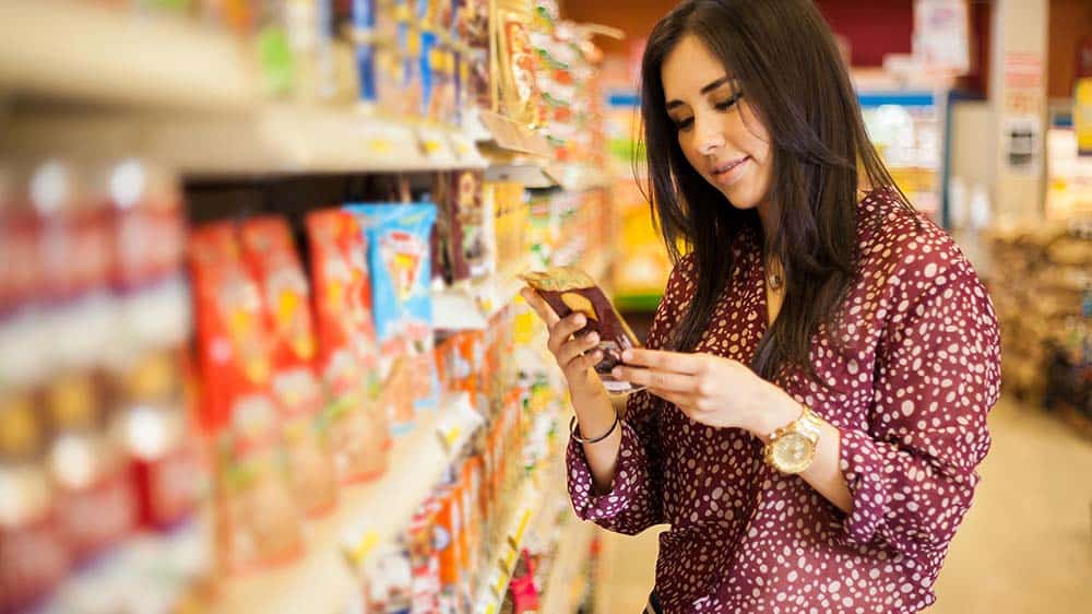 woman reading label shopping