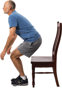 man getting up from chair