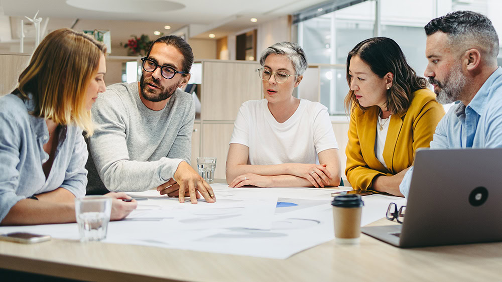 Professionals having a discussion at a meeting table