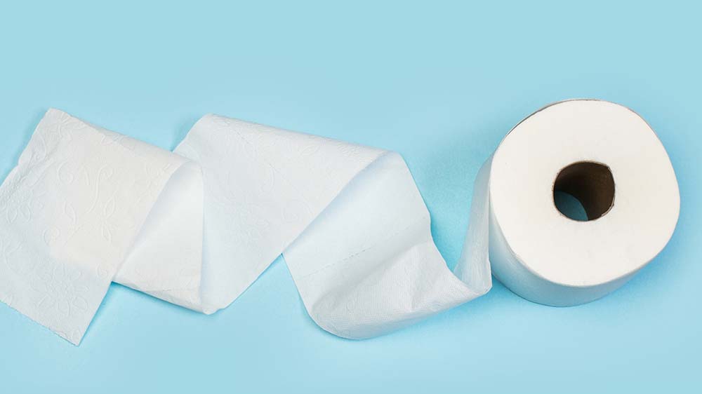 urinary incontinence and diabetes, toilet paper on a blue background