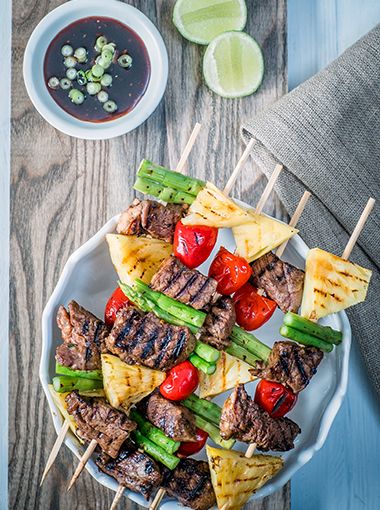 Meat and vegetables on skewers, placed on a plate