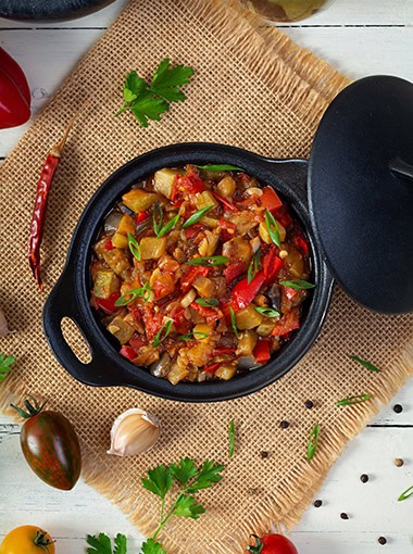Stewed vegetables with tomato sauce and herbs.