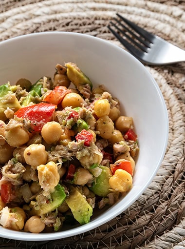 Fresh chickpea salad with tuna, tomato, pepper, onion and avocado