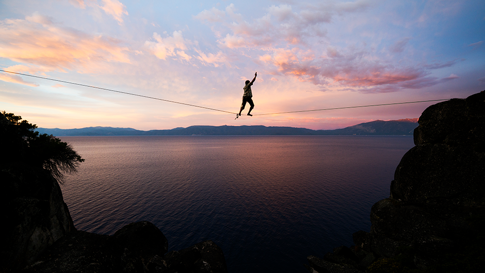 tightrope walker at sunset