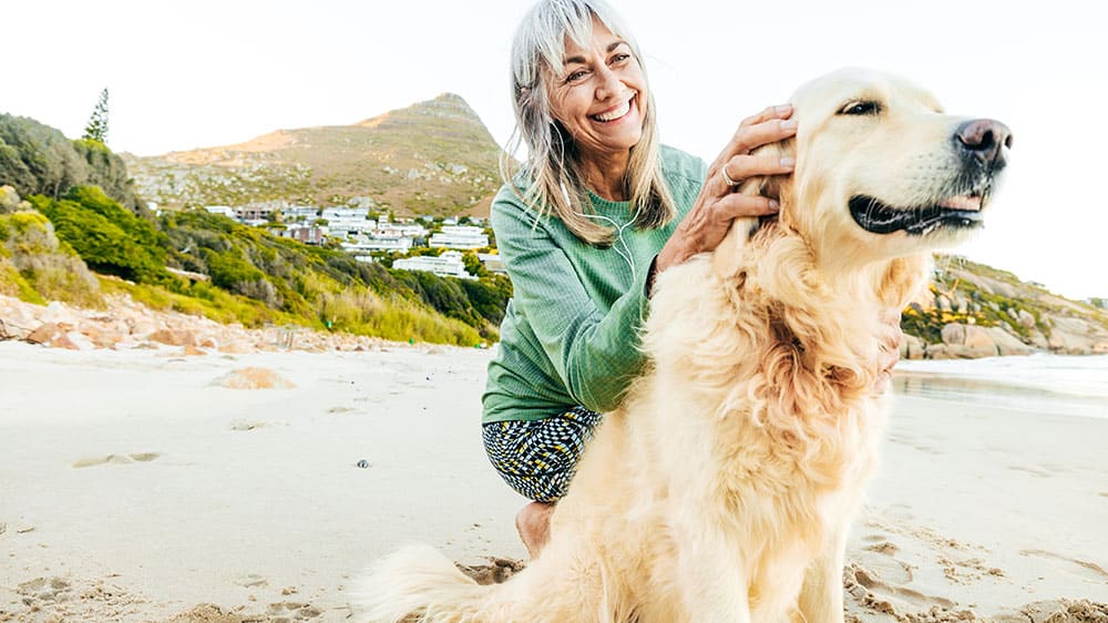 Woman and dog at the beach