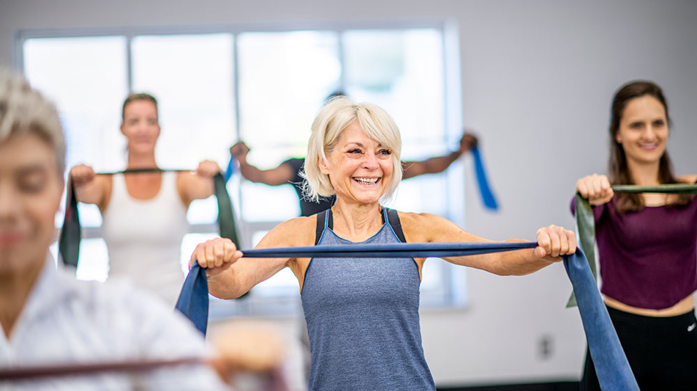 Woman participating in a class at the gym