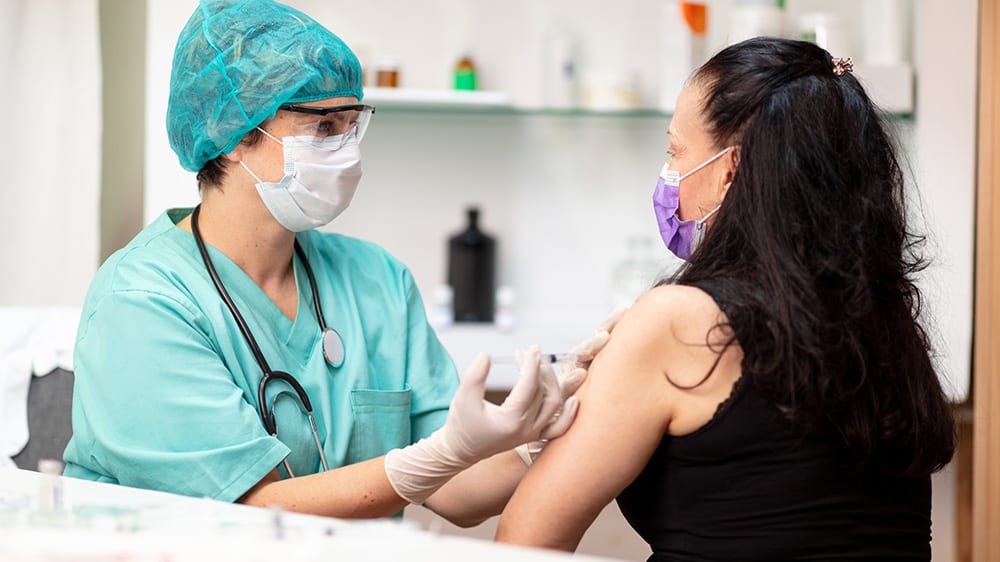 Woman receiving a flu vaccine