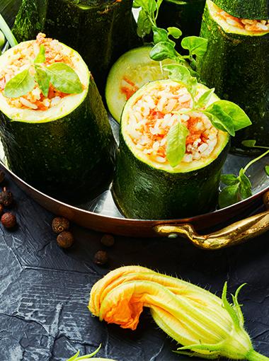 Stuffed zucchini topped with fresh herbs